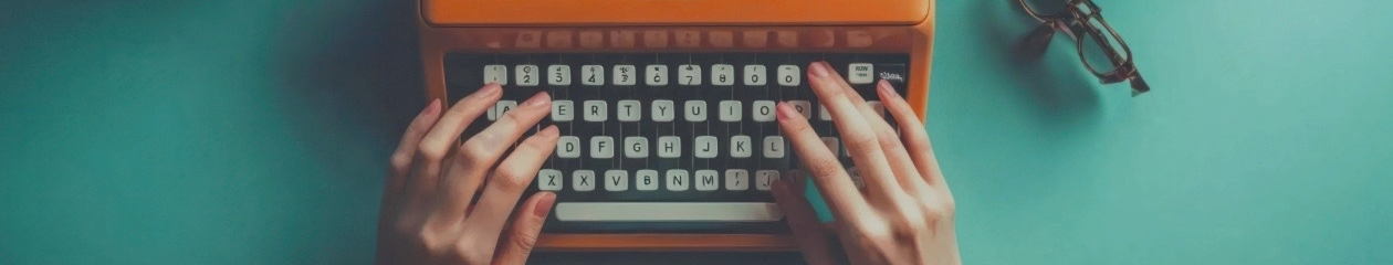 Hands at a typewriter, about to begin a new story