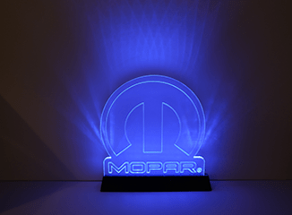 Illuminated glass Mopar logo light