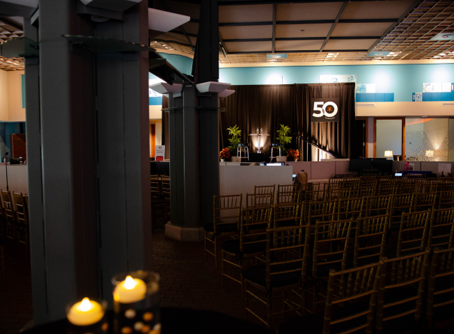 The JRT agency event photo of lighted stage and 50th logo